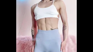 Nerdy cute together with petite Asian muscle girl flexes in workout leggings