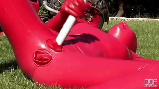 Busty babe toying in lively latexwear