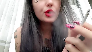 Smoking fetish from Dominatrix Nika The Dominatrix smokes sexy plus blows smoke in your face