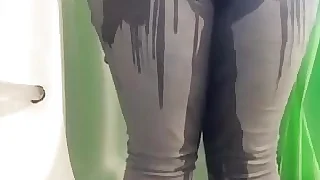 BBW here for detail viscera peeing relative to her grey jeans relative to shower